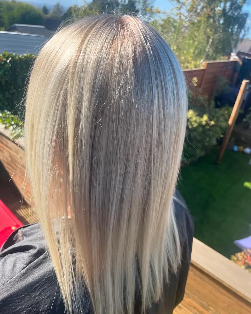 Long blonde hair with cool highlights, photographed in daylight